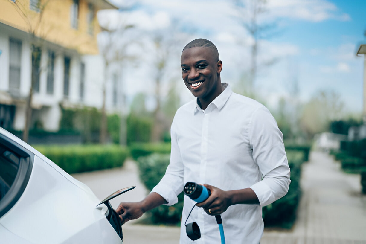 Nigerian Businessman charging electric car